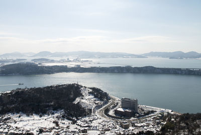 High angle view of city against cloudy sky