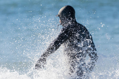 Man swimming in sea