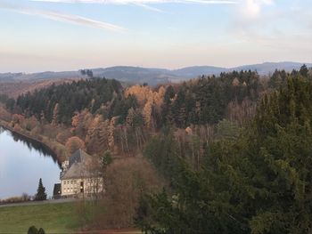 Panoramic view of trees and mountains against sky