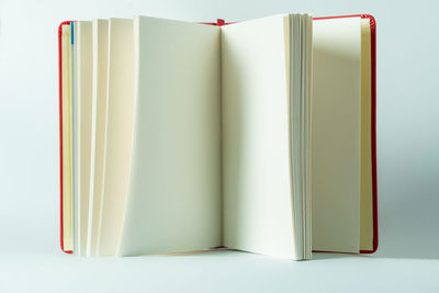 Close-up of open book against white background