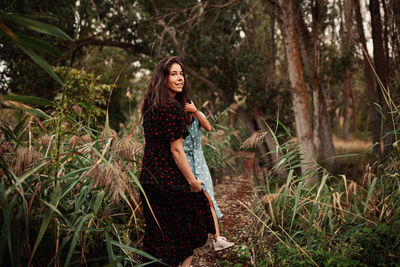 Young woman smiling in forest