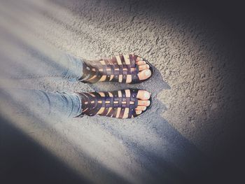 Low section of woman standing on floor