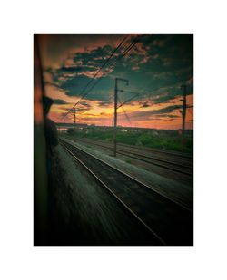 Railroad tracks seen through train window