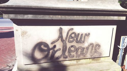 Close-up of text on wall