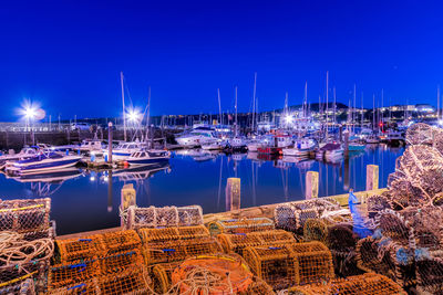 Boats moored at harbor