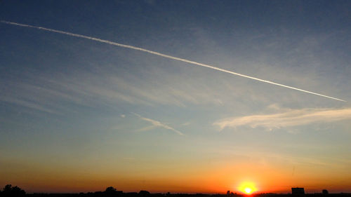 Scenic view of vapor trails in sky