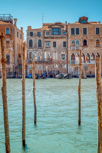 View of wooden post in canal