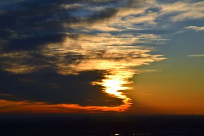 Scenic view of dramatic sky during sunset