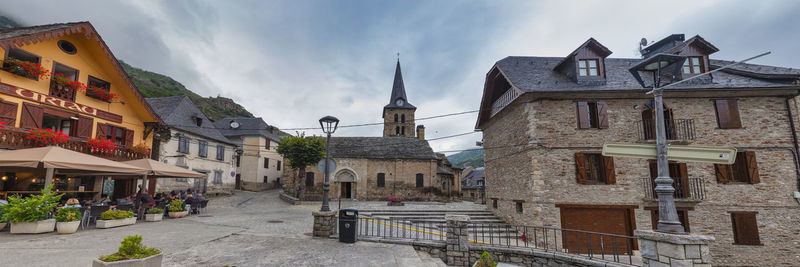 Panoramic view of buildings in city against sky