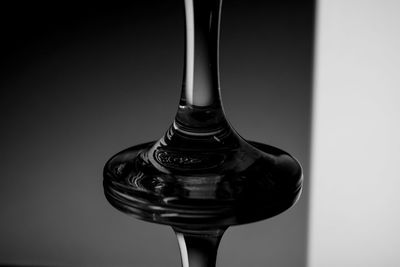 Close-up of glass bottle against white background