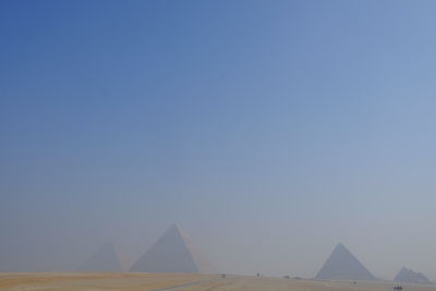 Low angle view of monument against clear blue sky