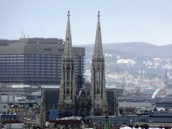 Buildings in city against sky