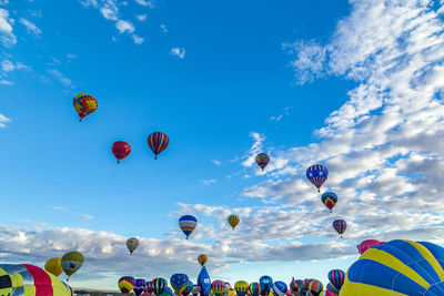 Low angle view of hot air balloons against sky