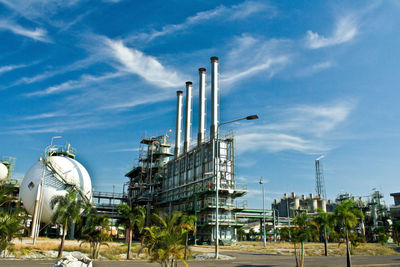 Low angle view of factory against sky