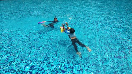 High angle view of people swimming in pool