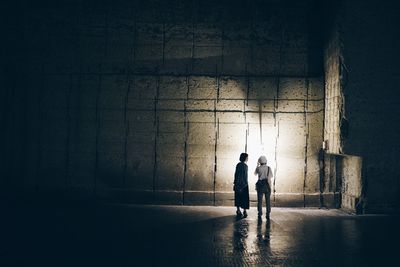 Full length of woman standing at night