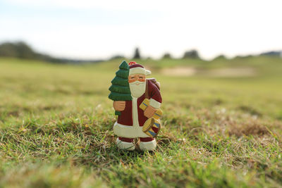 Close-up of stuffed toy on field