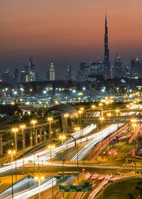 High angle view of illuminated city buildings at night