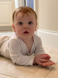 Portrait of cute baby girl at home