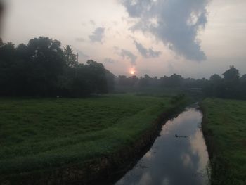 Scenic view of landscape against sky during sunset