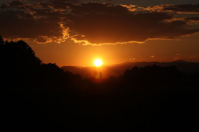 Scenic view of silhouette landscape against sky during sunset