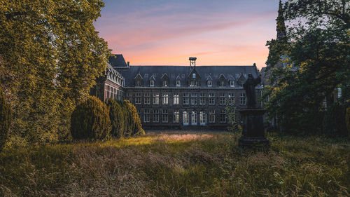 Old building against sky during sunset