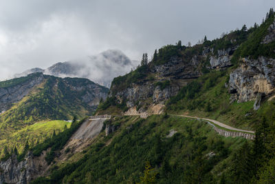 Scenic view of landscape and mountains against sky