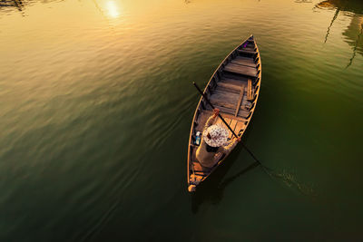 High angle view of woman on boat swimming in river