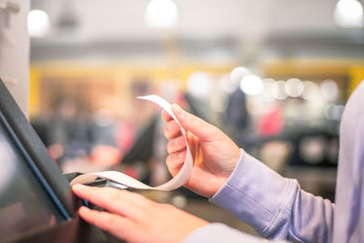 Close-up of man using mobile phone