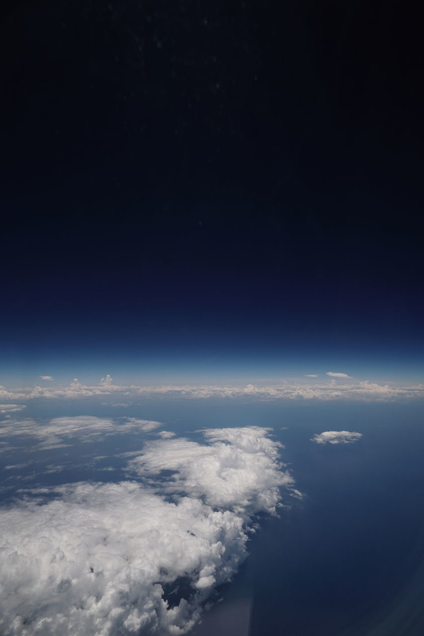 AERIAL VIEW OF CLOUDSCAPE OVER LANDSCAPE