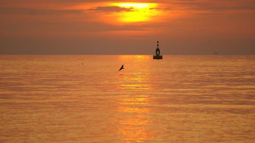 Scenic view of sea at sunset