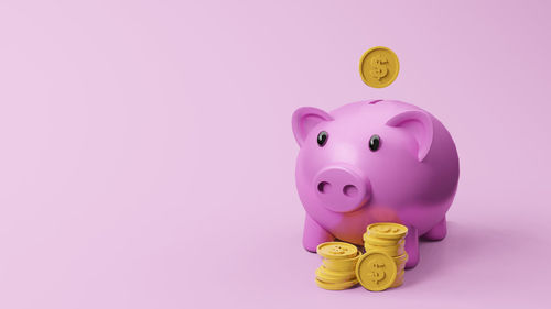 Close-up of yellow toy against pink background