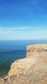 Scenic view of sea against blue sky