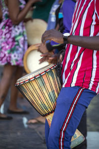 Midsection of man playing tabala