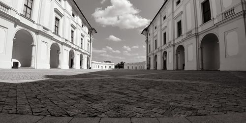 Street amidst buildings in city against sky