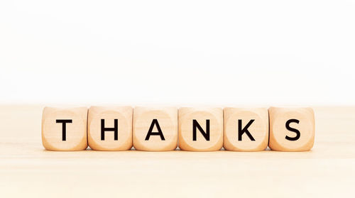 Text written on wood against white background