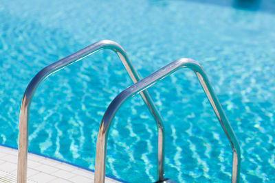 Close-up of swimming pool against blue sky