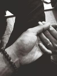 Close-up of couple holding hands
