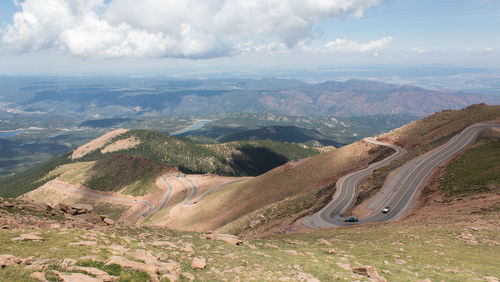 Curved empty road along barren landscape