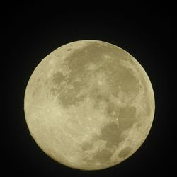 Low angle view of moon against clear sky at night