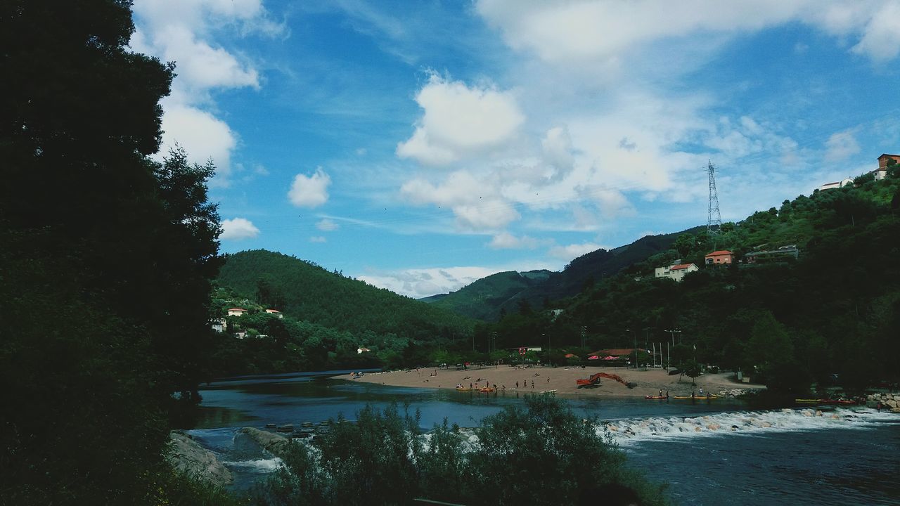 mountain, tree, sky, cloud - sky, tranquil scene, tranquility, water, scenics, mountain range, beauty in nature, nature, cloud, lake, cloudy, river, non-urban scene, landscape, transportation, day, outdoors