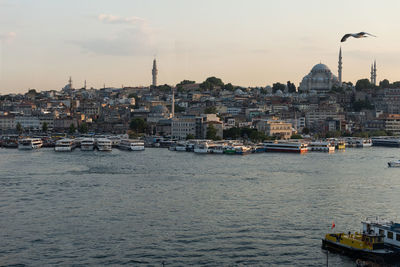 View of buildings in city by sea