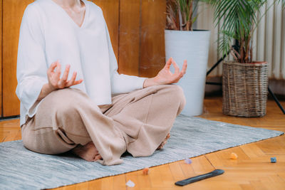 Gratefulness meditation, gyan mudra. peaceful woman sitting and meditating.