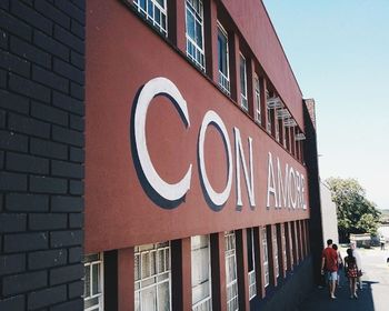 Road sign in front of building