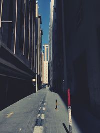 Alley amidst buildings in city