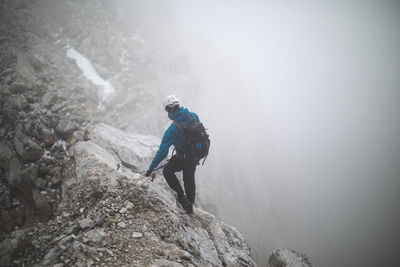 Man standing on cliff