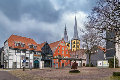 Buildings in city against sky