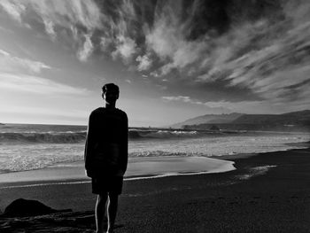 Silhouette of man standing on beach