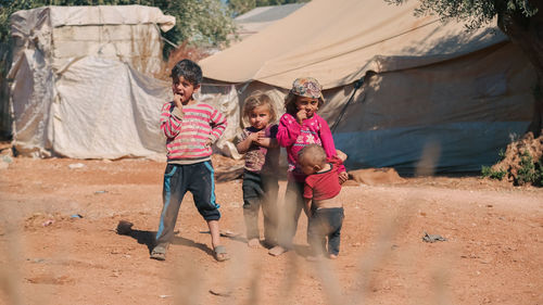 Syrian children inside their tent in the middle of a refugee camp near the turkish border.
