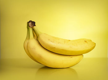 Close-up of fruit against yellow background